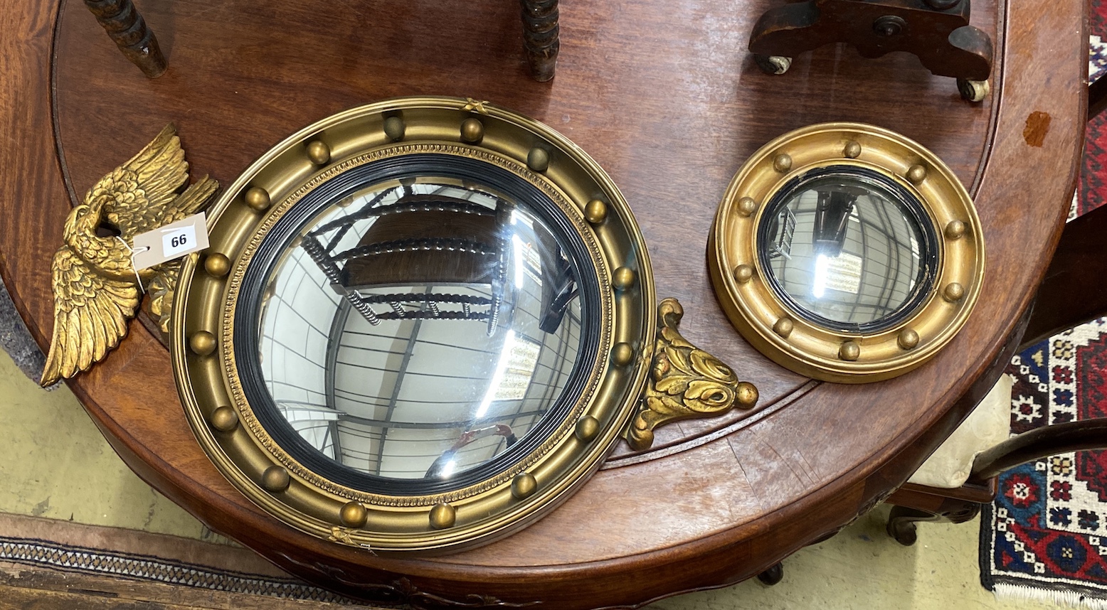 Two Regency style convex wall mirrors, larger height 61cm